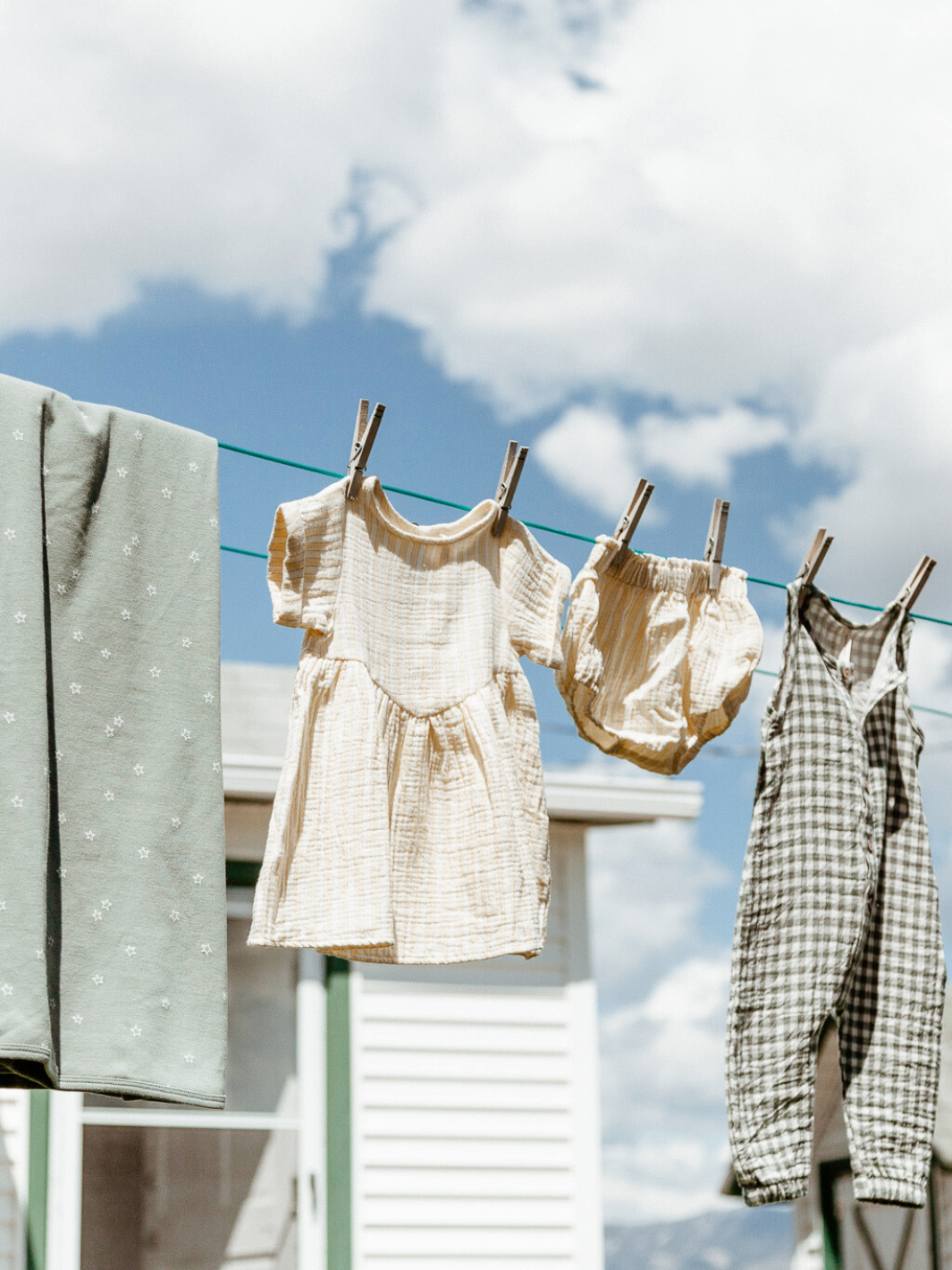 Littles clothing hanging on clothesline. Heyday Bozeman